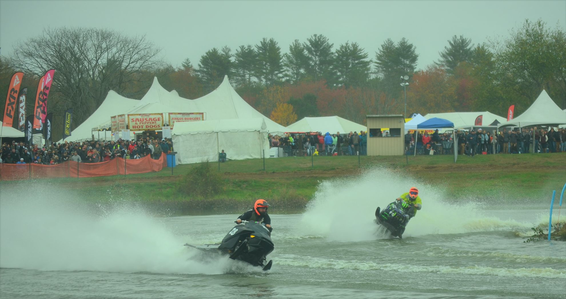 Racers compete in a watercross event at the Grass Drags in Fremont